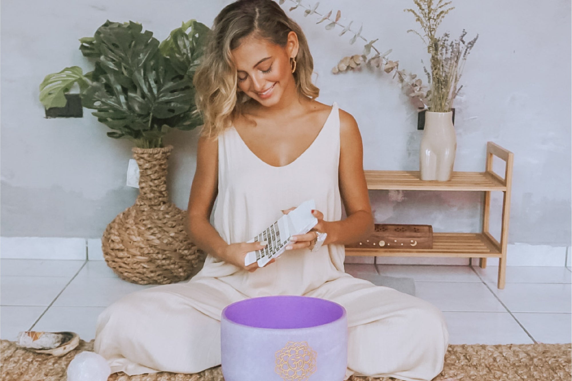 Picture of Amanda Antonella meditating with crystals and a singing bowl