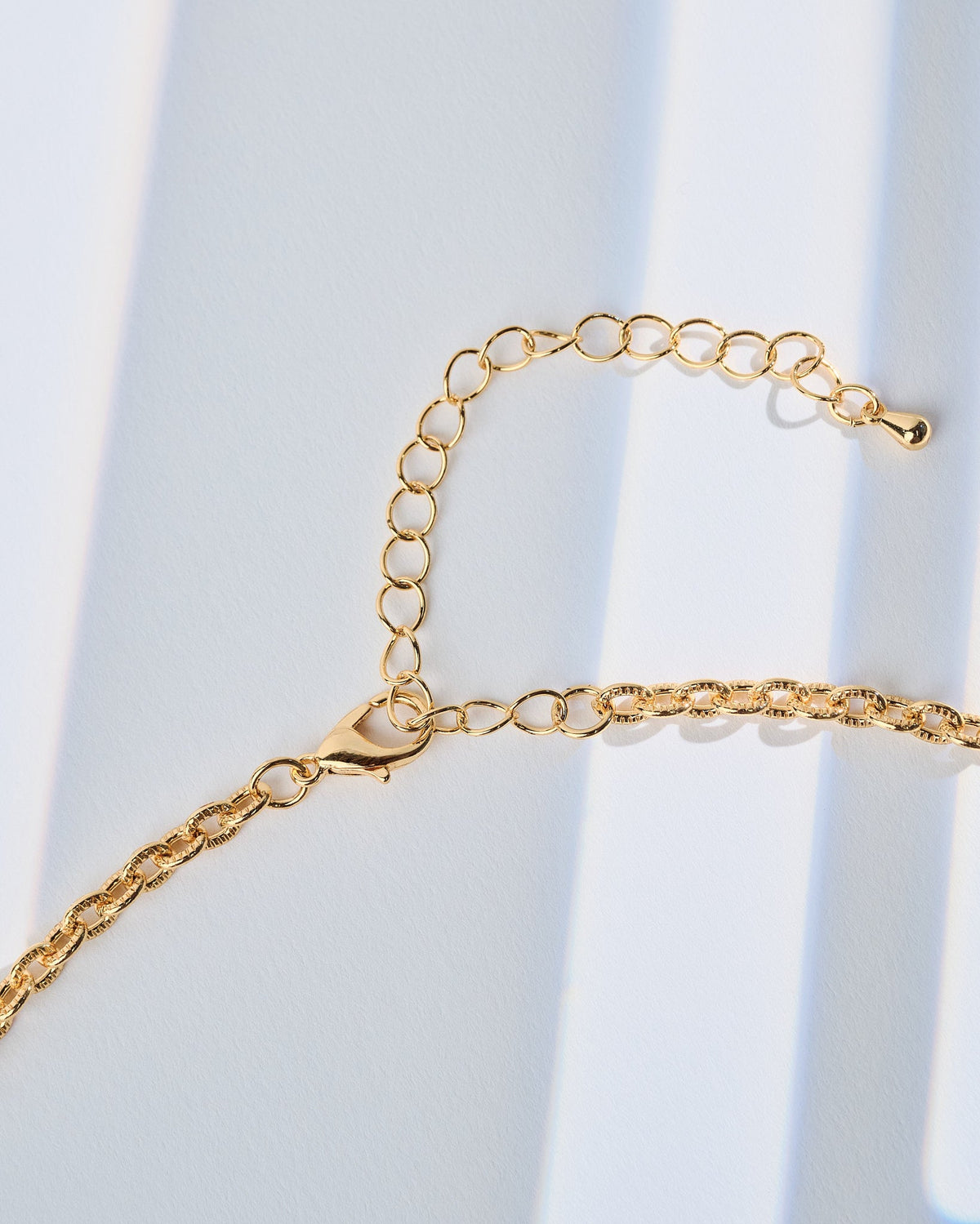 16K Plated Tracks Charm Necklace