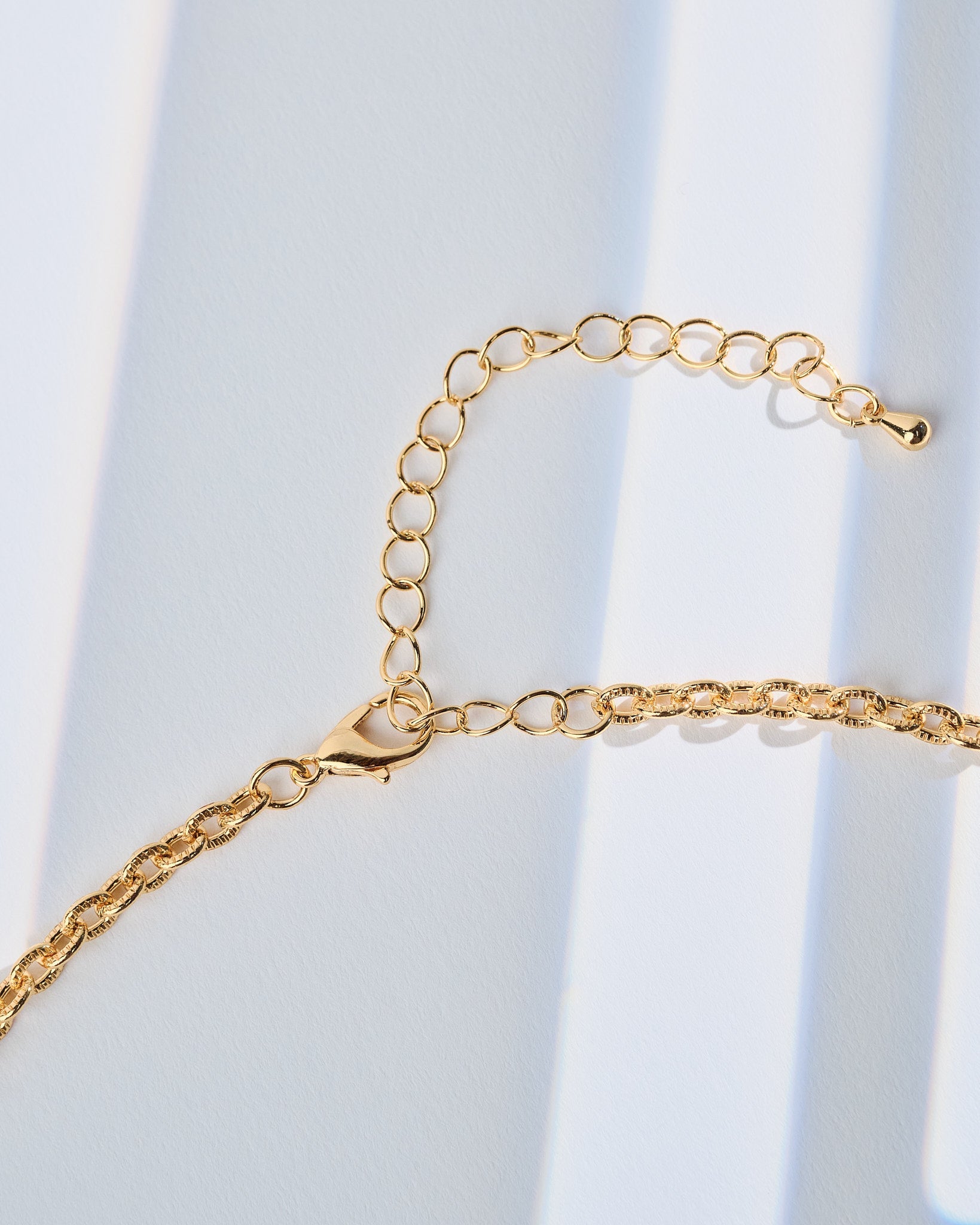 16K Plated Tracks Charm Necklace