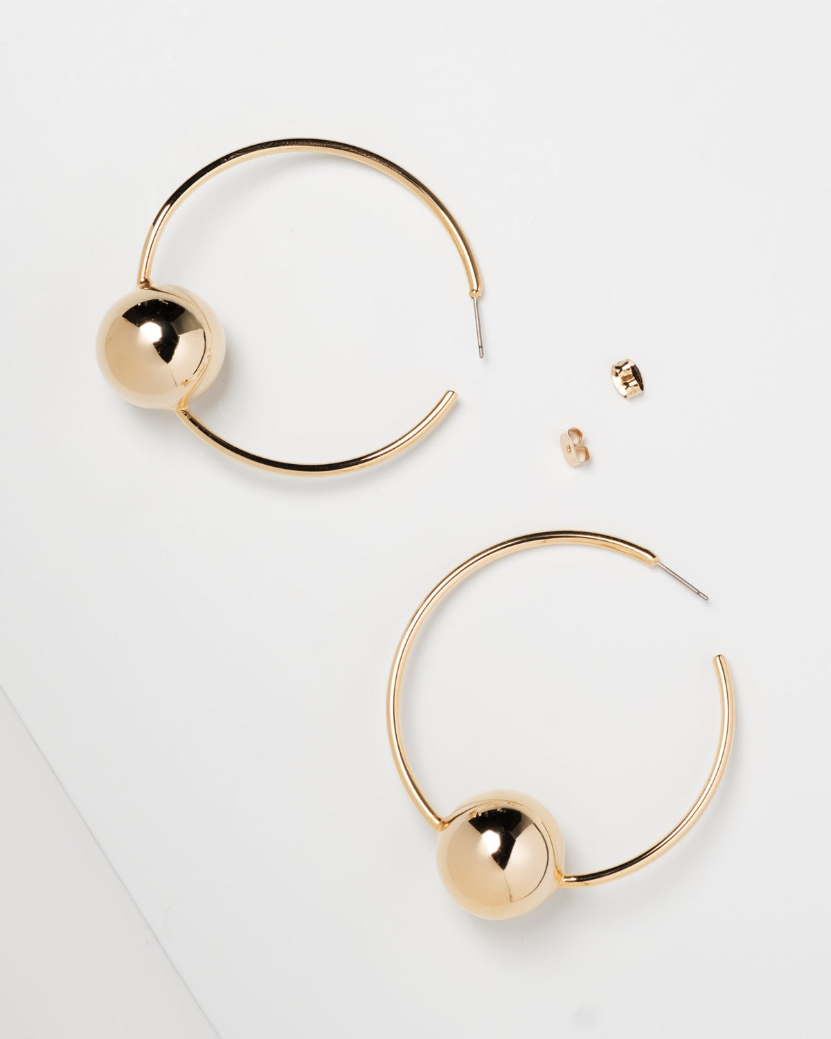 Hoop earrings with balls in the middle sales